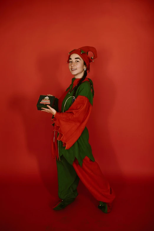 a woman wearing a green and red costume