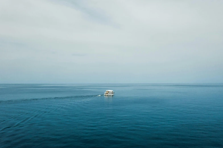 a boat is in a very big body of water