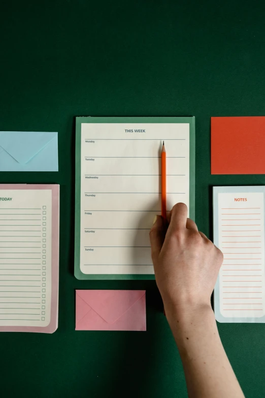 a person writing on a notepad with a pencil, by Anita Malfatti, green and pink colour palette, 3 - piece, organized, cardstock