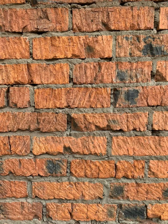 a yellow and gray brick wall with the light on