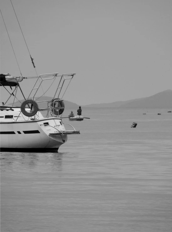 a black and white photo of a boat in the water, a black and white photo, by Michalis Oikonomou, with anchor man and woman, very accurate photo, beautiful morning, ilustration