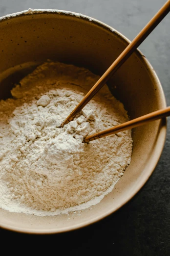 a bowl of flour with chopsticks in it, earthy, thumbnail, uncrop, defined