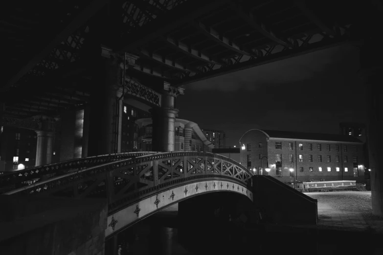 a black and white photo of a bridge at night, a black and white photo, inspired by Thomas Struth, pexels contest winner, manchester, detailed medium format photo, today\'s featured photograph 4k, reddish