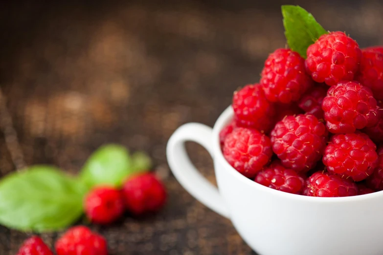 raspberries with a few leaves on the top