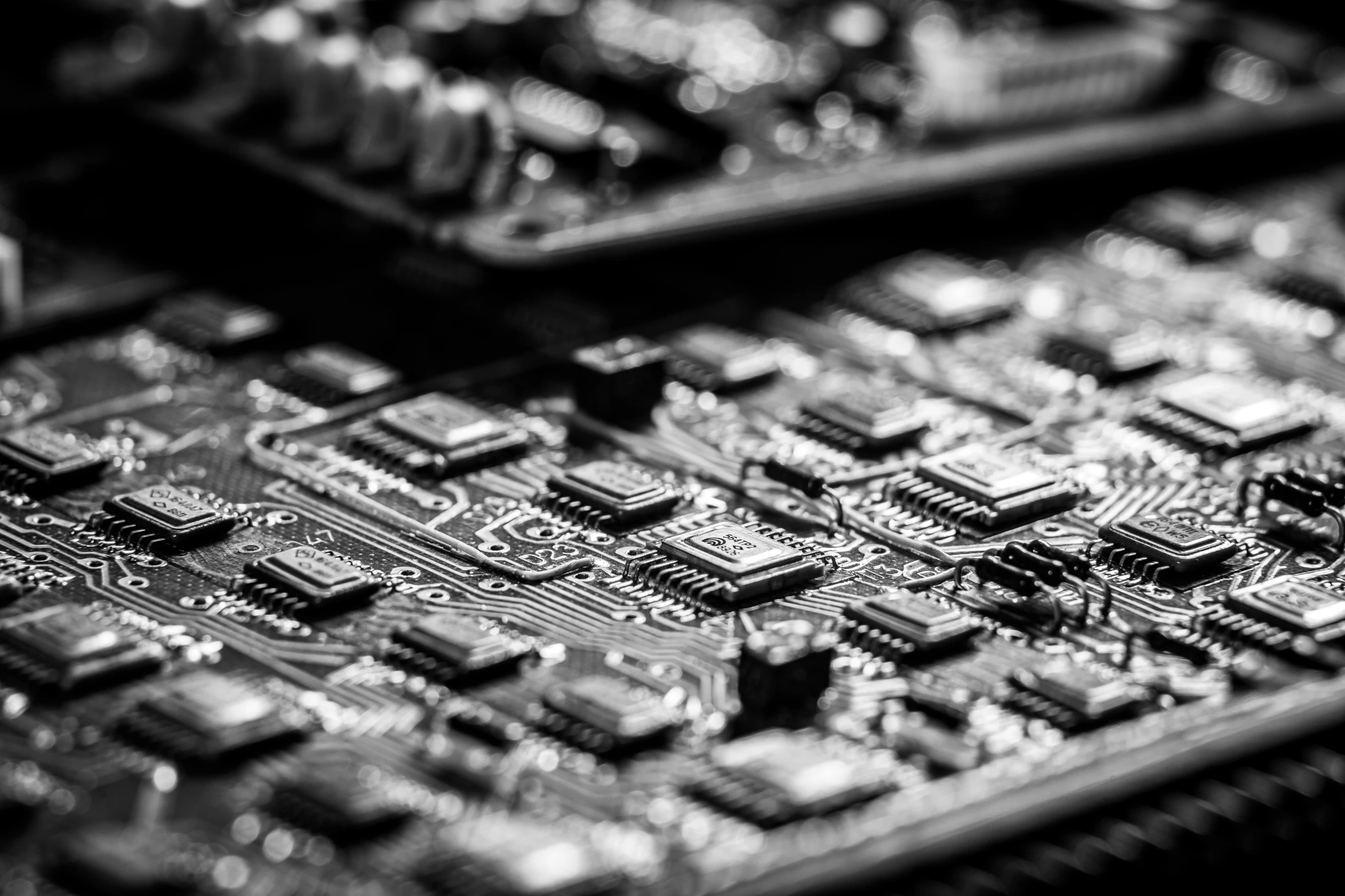 a close up of a computer mother board, by Adam Marczyński, bw photo, panel, luxurious, rich evans
