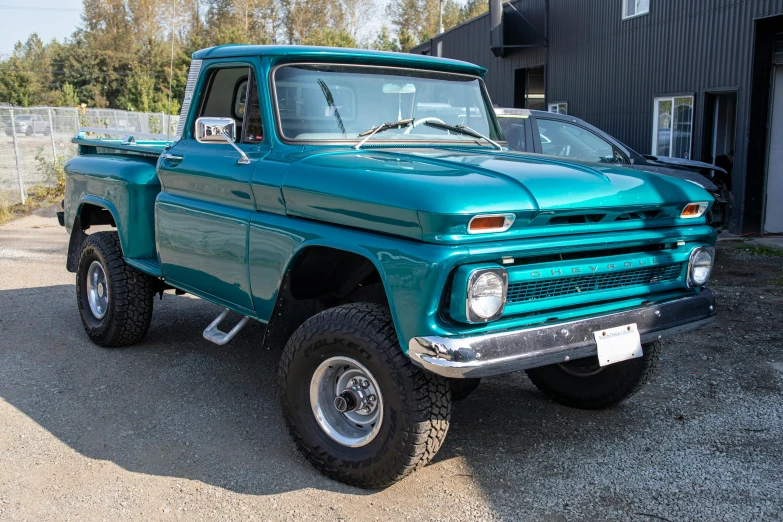 a green truck parked in front of a building, a portrait, unsplash, insanely detailed c 10.0, lake blue, off - road, 1966