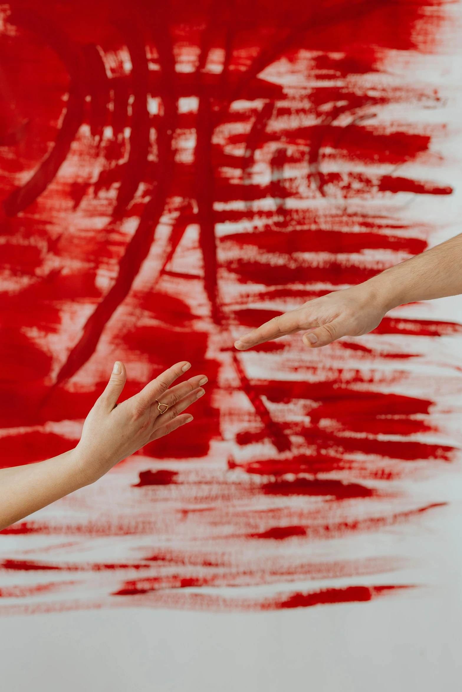 a man and a woman shaking hands in front of a painting, inspired by Chiharu Shiota, pexels contest winner, action painting, red fluid, antoni tapies, white red, waving arms