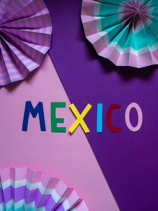 colorful paper fans with the word mexico on them, by Rachel Reckitt, international typographic style, ((purple)), press shot, geometric backdrop; led, may)