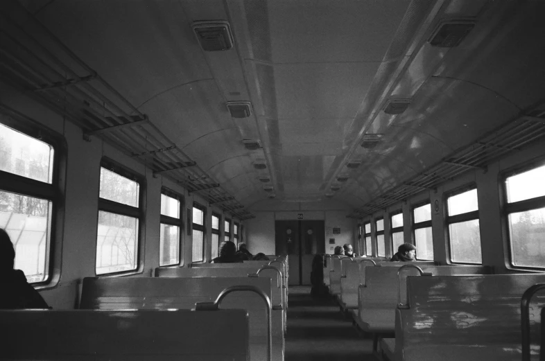 a black and white photo of a train car, by Maurycy Gottlieb, flickr, sōsaku hanga, ilford hp 5, interior view, polar express, 1 9 7 5 photo