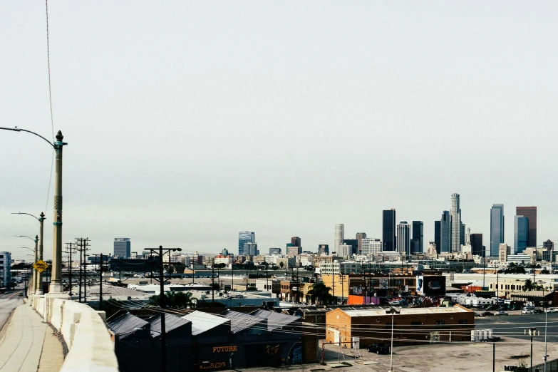 a view of a city from the top of a building, a photo, by Carey Morris, unsplash, los angelos, plain background, background image, city + graffiti background