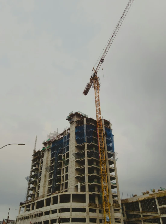 a tall building with a crane on top of it, profile image, south jakarta, avatar image, in 2 0 1 5