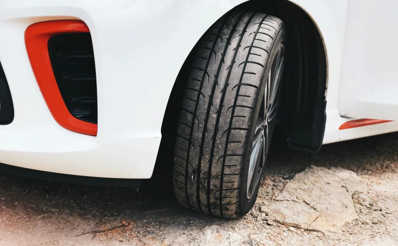 there is a close up s of some tire treads on a white vehicle