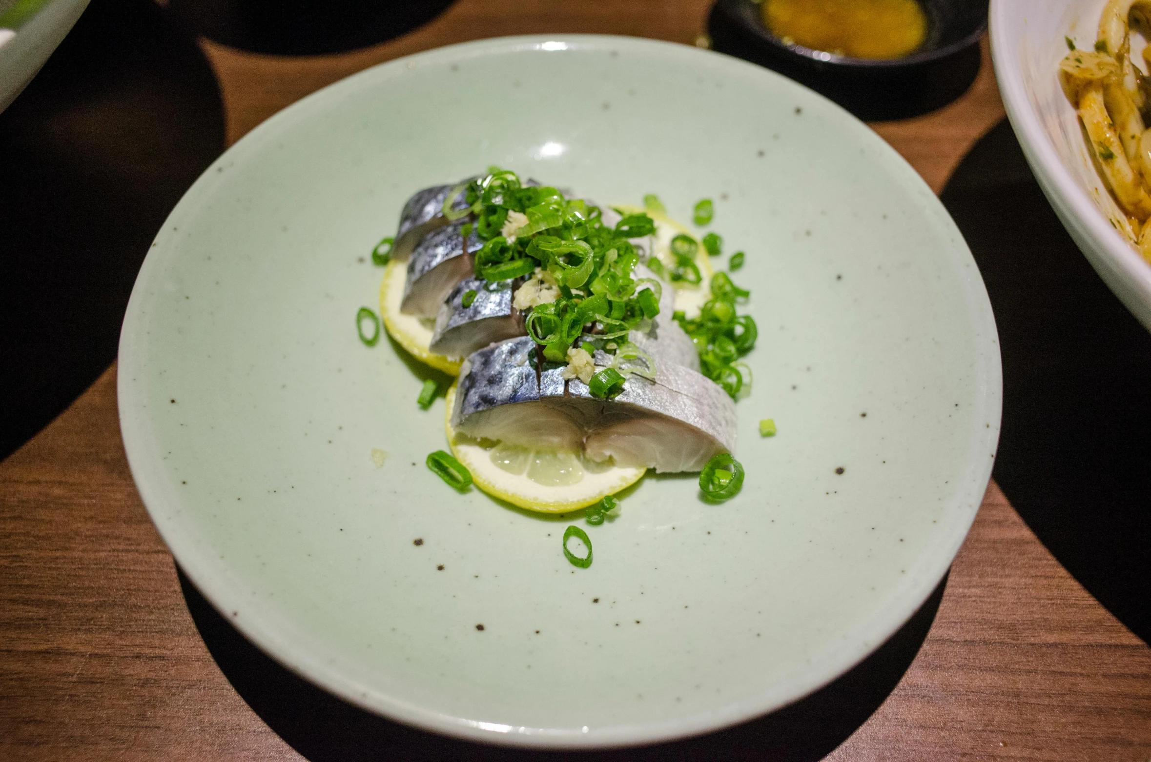 a dish with a silver wrap sitting on a table