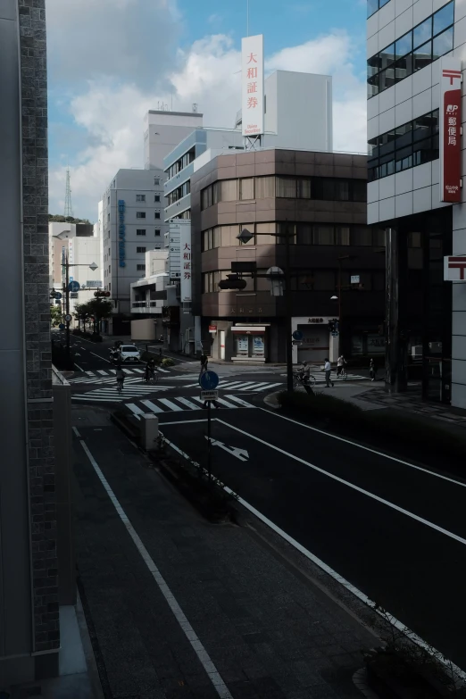 street with train tracks passing by and modern building