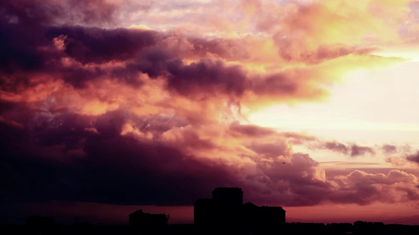 there is a plane that is flying in the sky, inspired by Elsa Bleda, unsplash, brutalism, ((sunset)), dark purple clouds, pink, skyscapers