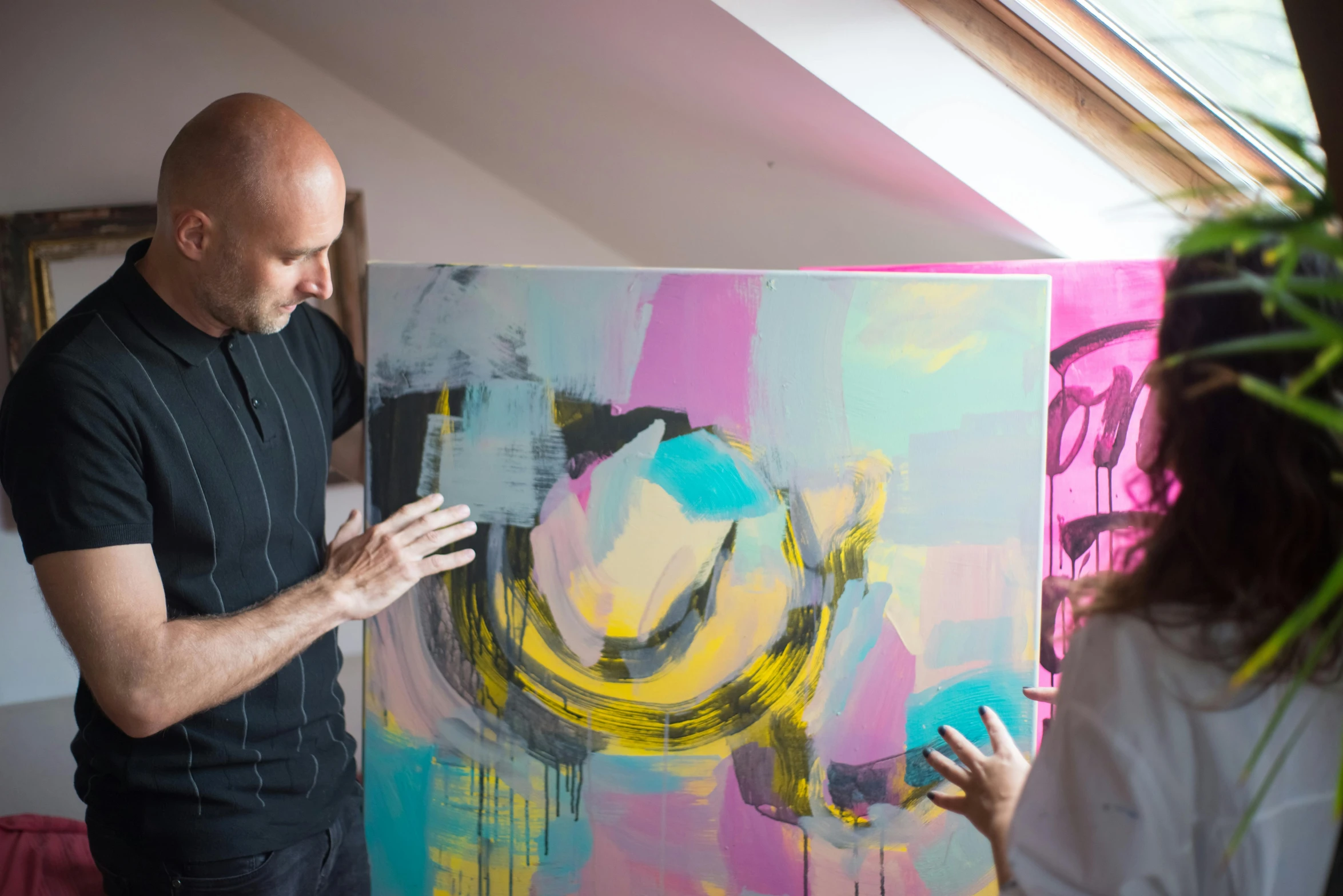 a man that is standing in front of a painting, inspired by Peter Lanyon, pexels contest winner, action painting, turquoise pink and yellow, dave mckean and stina persson, filling the frame, paul davey