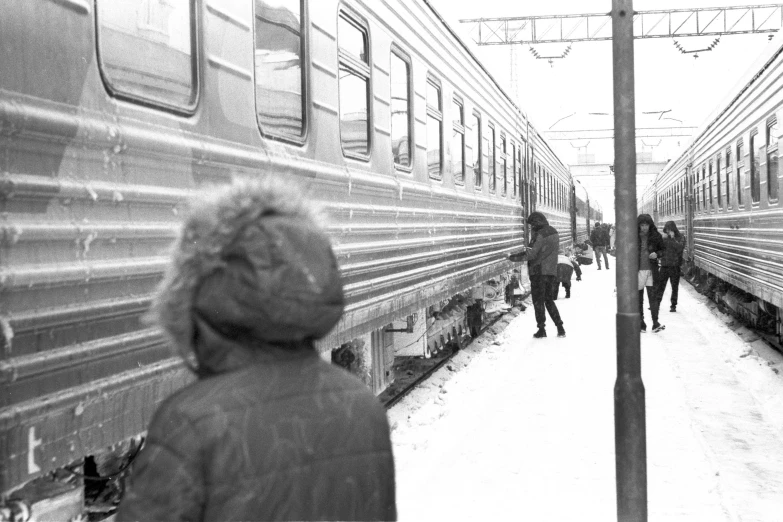 a black and white photo of people at a train station, a black and white photo, winter season, 000 — википедия, childhood friend, explorer