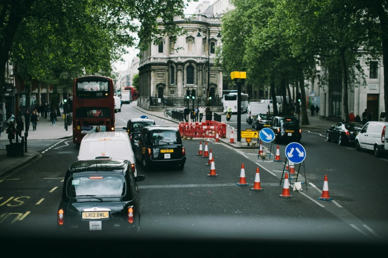 a city street with construction and traffic cones