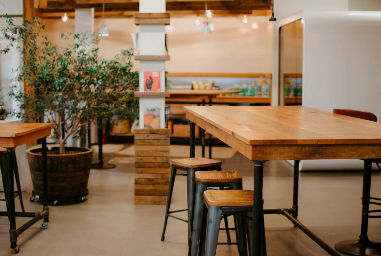 a room with bar chairs and tables in it