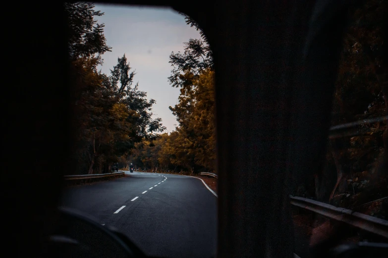 a car driving down a road next to a forest, inspired by Elsa Bleda, pexels contest winner, looking through a portal, late summer evening, view from inside, rectangle