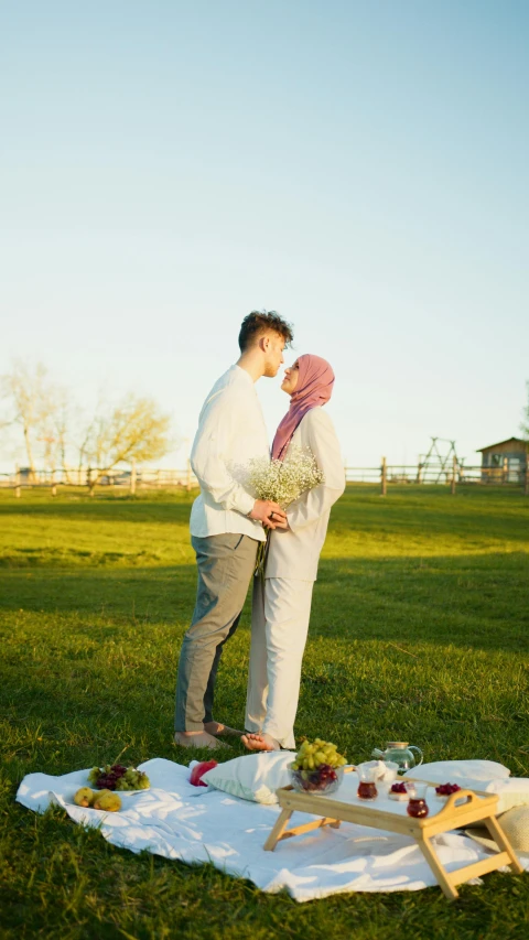 a man and woman standing next to each other on a blanket, a picture, by Basuki Abdullah, pexels, hurufiyya, standing in a grassy field, bouquet, 15081959 21121991 01012000 4k, romantic lead