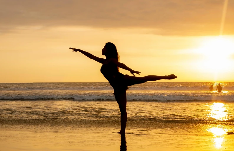 a woman doing a yoga pose on the beach, pexels contest winner, arabesque, classic dancer striking a pose, (golden hour), profile image, leg