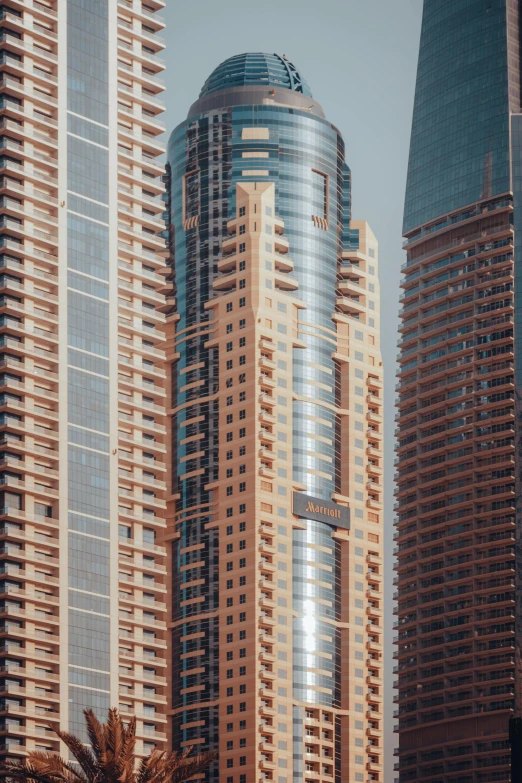 some very tall buildings near each other in a city