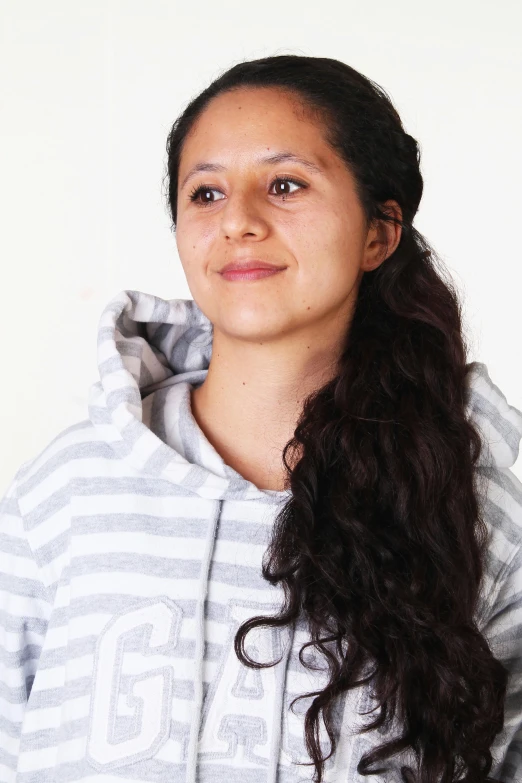 a woman in a hoodie posing for a picture, inspired by Gina Pellón, on clear background, in 2 0 1 5, student, eloy morales