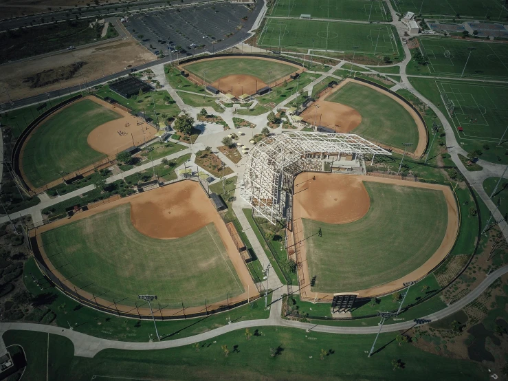 an aerial view of a baseball field, by Sam Black, unsplash contest winner, conceptual art, massive structures, park in background, oc, cotton