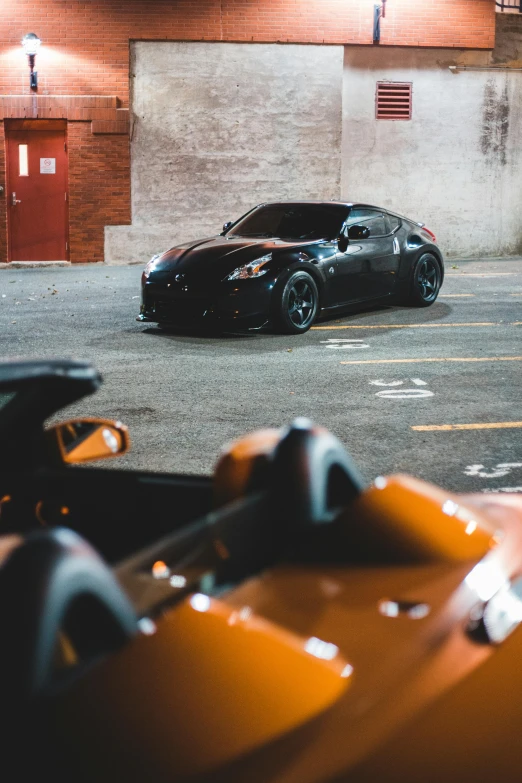 a parking lot full of cars and parked motorcycles