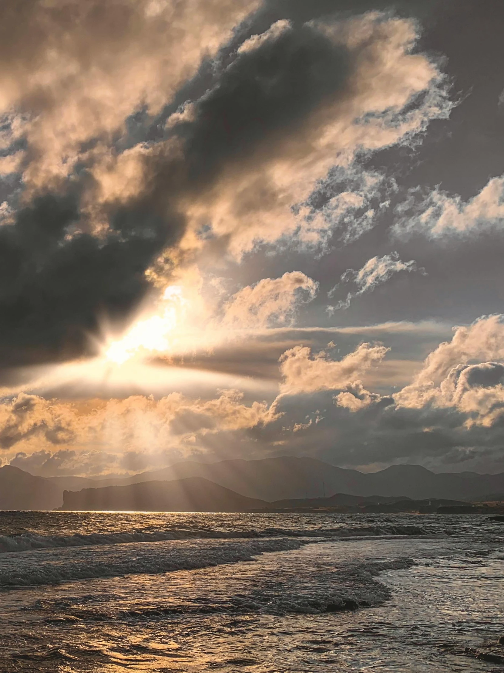 the sun is shining through the clouds over the ocean, inspired by Edwin Deakin, unsplash contest winner, distant mountains lights photo, today\'s featured photograph 4k, 8k fine art photography, beach surreal photography