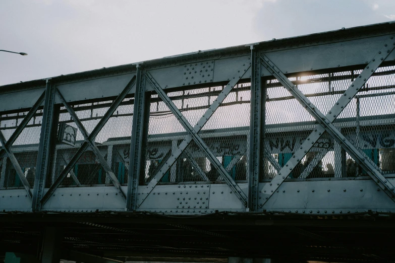 a very large train bridge with a train traveling over it