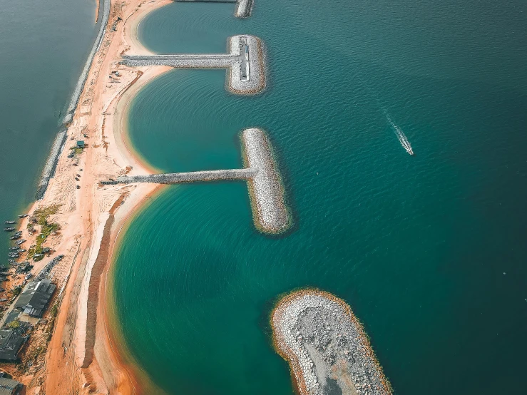 a large body of water next to a beach, by Carey Morris, pexels contest winner, happening, infrastructure, dubai, aqueducts, “ iron bark