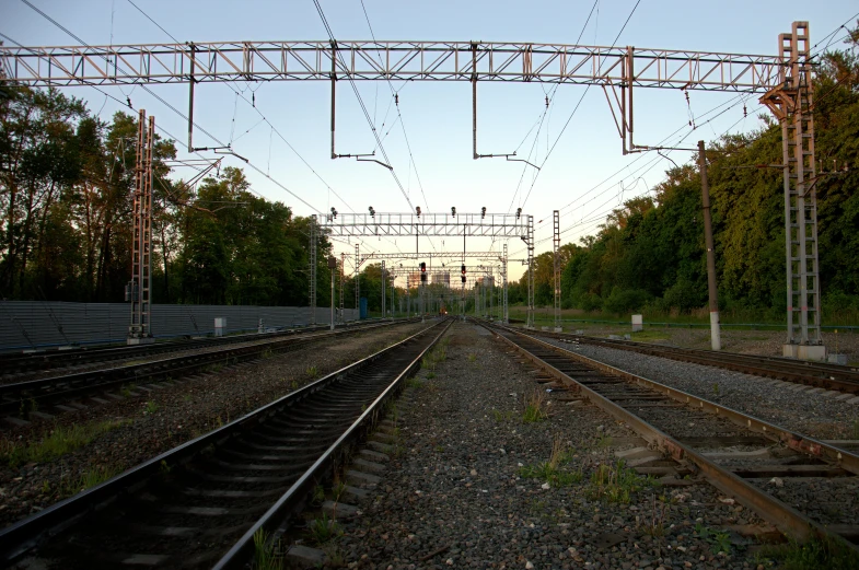 a couple of train tracks that are next to each other, by Jan Tengnagel, electrical signals, 2022 photograph, sergey krasovskiy, bright sky