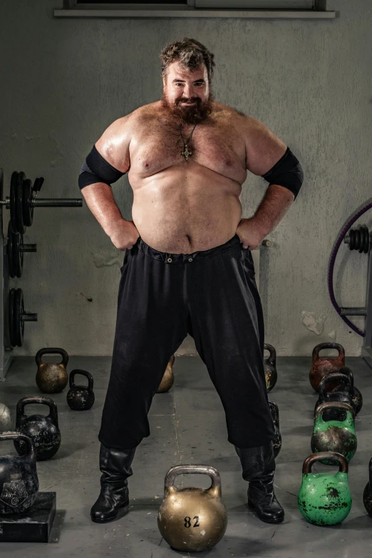 a man that is standing in a room with kettles, an album cover, inspired by Mark Zug, featured on reddit, transgressive art, chris evans as a powerlifter, 1 9 9 0's wwe publicity photo, fluffy body, img _ 9 7 5. raw