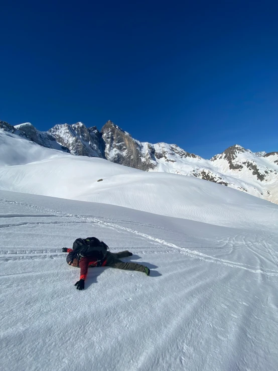 a person riding skis down a snow covered slope, a picture, by Cedric Peyravernay, resting after a hard mission, 8 k )