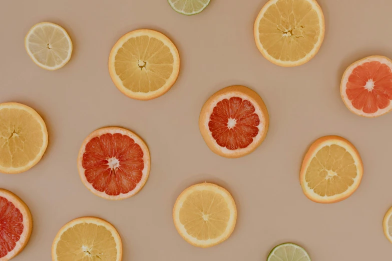 oranges, limes, and grapefruits are arranged in a circle, by Carey Morris, trending on pexels, minimalist wallpaper, tans, licking out, 🐿🍸🍋