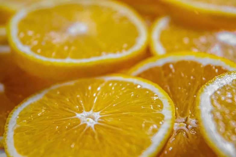 a close up of a bunch of orange slices, by Carey Morris, pexels, 🦩🪐🐞👩🏻🦳, yellow-orange, juice, super detailed image