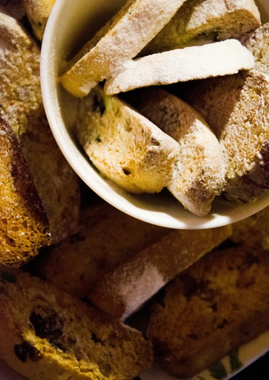 a bowl of bread sitting on top of a plate, holding a baguette, promo image, many details, thumbnail