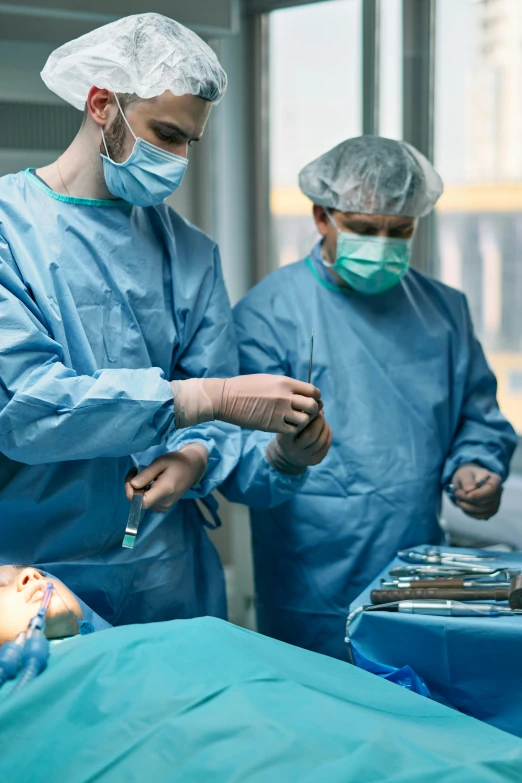 a group of surgeons working on a patient, by Adam Marczyński, shutterstock, multiple stories, wide shot photograph, lgbtq, 2717433015