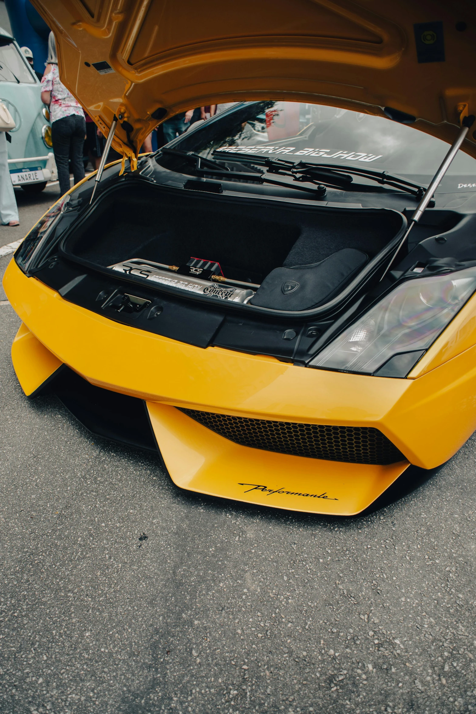 a yellow lamb gtp car with a hood open