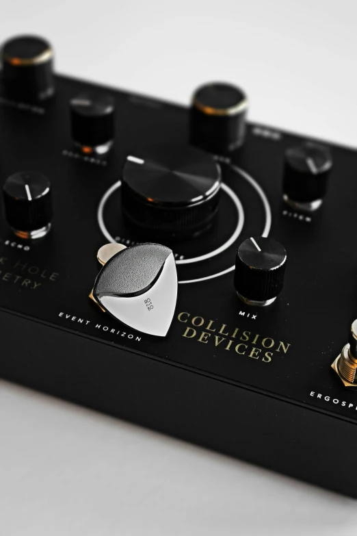 a close up of a guitar pedal on a white surface, by Jesper Knudsen, celestial collision, jaquet droz, thumbnail, showcase