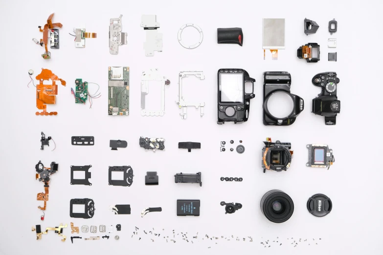 a variety of electronic components laid out on a white surface, a picture, by Alejandro Obregón, unsplash, assemblage, sony a3iii camera shot, exploded view, medium format camera, medium format