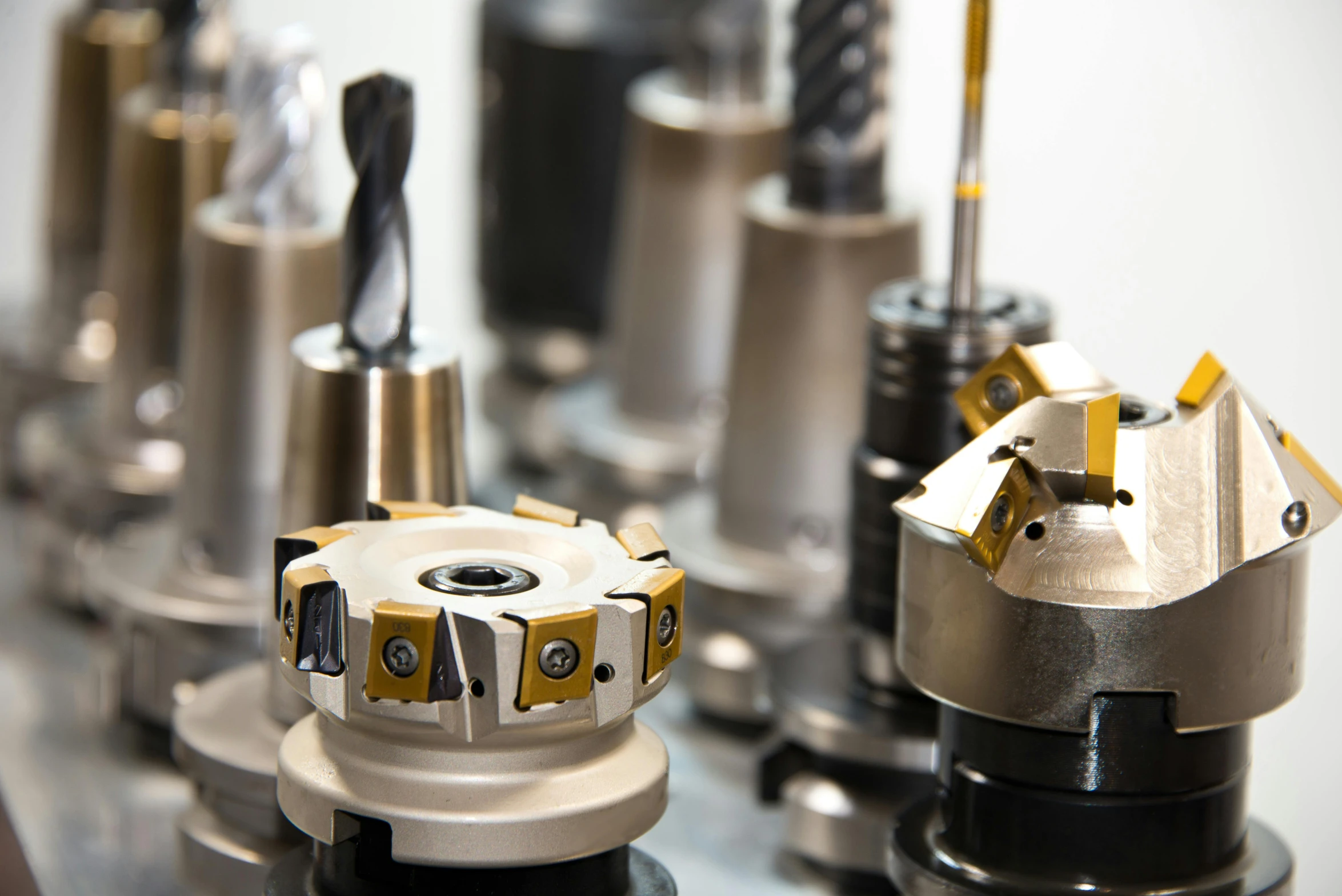 a bunch of tools sitting on top of a table, golden machine parts, high technology inplants, thumbnail, mills