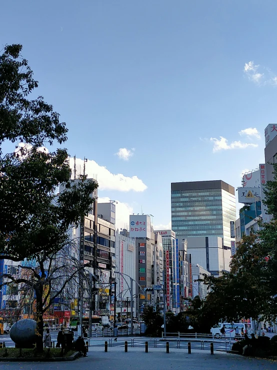 a street with tall buildings near some trees