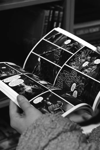 a black and white photo of a person reading a comic book, a comic book panel, by Altichiero, cinematic-shot, pages, high quality image, sardax
