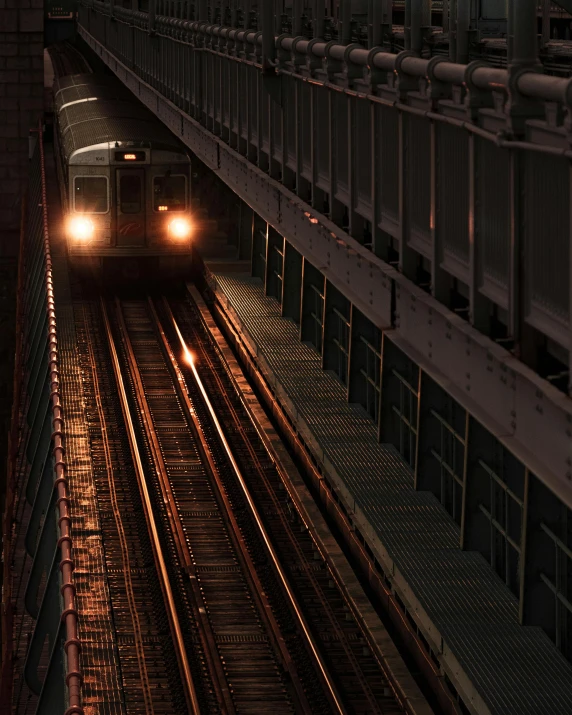 a large long train on a steel track, an album cover, by Andrew Domachowski, unsplash contest winner, mta subway entrance, night light, 500px, [ [ hyperrealistic ] ]