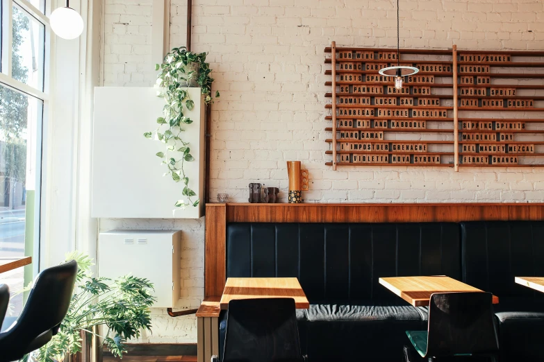 a couple of tables that are in a room, by Carey Morris, trending on unsplash, restaurant menu photo, hanging scroll on wall, caulfield, ignant