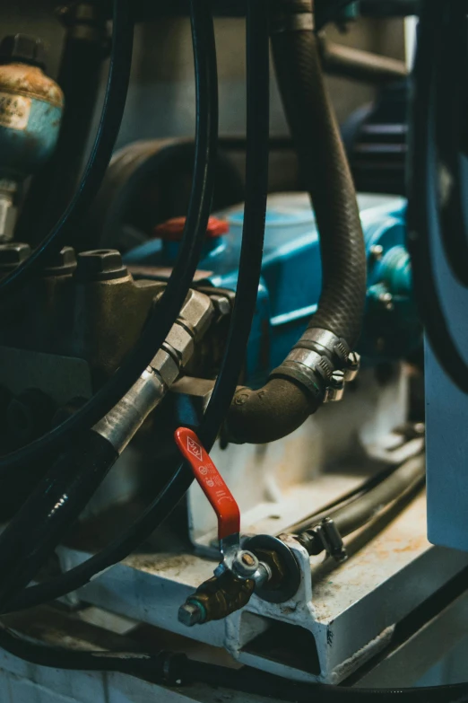 a machine that is sitting on top of a table, by Adam Marczyński, pexels contest winner, hoses:10, large blue engines, rubber hose, high angle close up shot