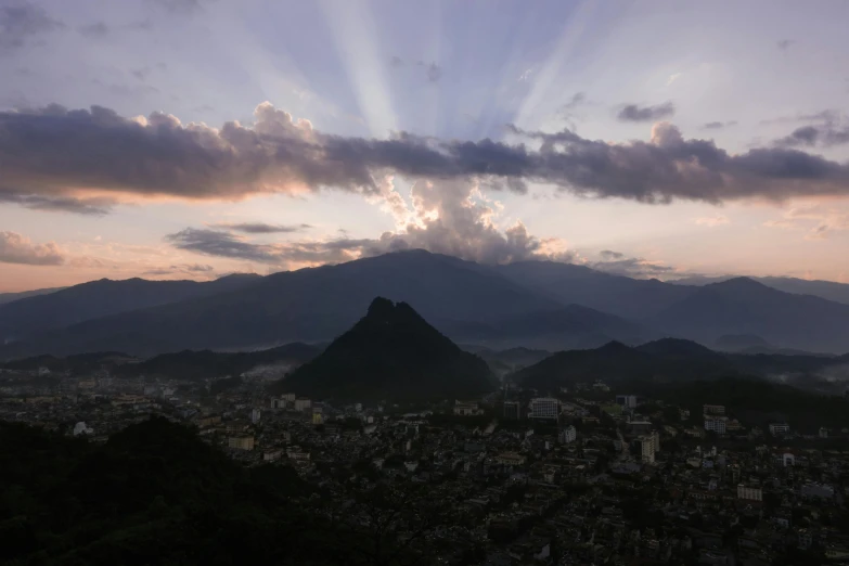 the view of a city under a cloudy sky